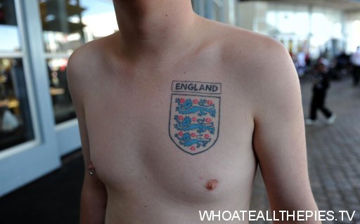 An England fan with a threee lions tattoo as supporters begin to arrive in 