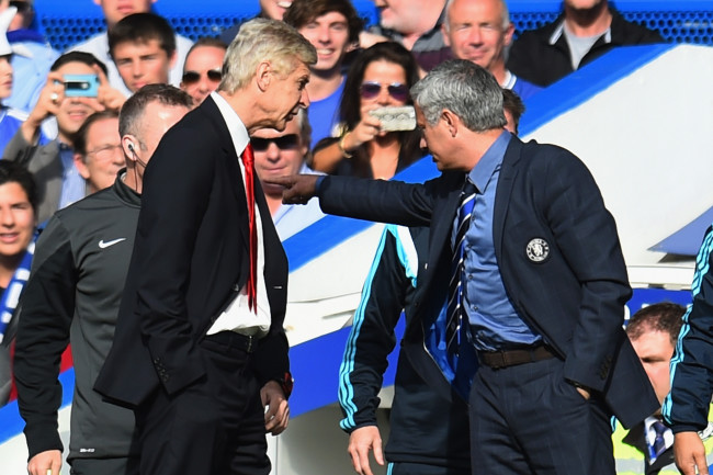 LONDON, ENGLAND - OCTOBER 05:  Managers Arsene Wenger of Arsenal and Jose Mourinho manager of Chelsea clash during the Barclays Premier League match between Chelsea and Arsenal at Stamford Bridge on October 4, 2014 in London, England.  (Photo by Shaun Botterill/Getty Images)