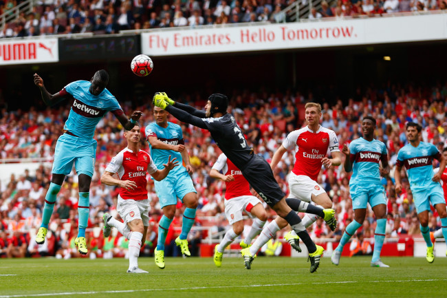LONDON, ENGLAND - AUGUST 09:  Petr Cech of Arsenal fails to punch clear the ball as Cheikhou Kouyate of West Ham United heads in the opening goal during the Barclays Premier League match between Arsenal and West Ham United at the Emirates Stadium on August 9, 2015 in London, England.  (Photo by Julian Finney/Getty Images)