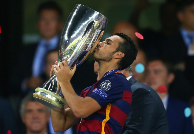 TBILISI, GEORGIA - AUGUST 11:  Pedro of Barcelona  kisses the UEFA Cup trophy as Barcelona celebrate victoy during the UEFA Super Cup between Barcelona and Sevilla FC at Dinamo Arena on August 11, 2015 in Tbilisi, Georgia.  (Photo by Chris Brunskill/Getty Images)