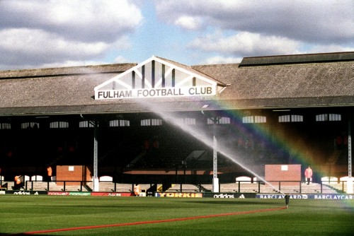 A sprinkler creates a rainbow as the pitch at Craven Cottage is tended to